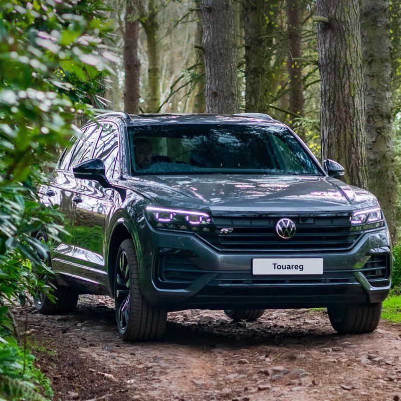 A Volkswagen Touareg parked in the forest