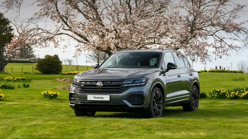 A Touareg parked in a field on a spring day 