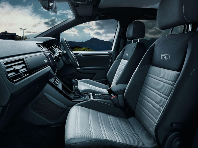 Volkswagen Touran interior with the front seats, steering wheel, dashboard, centre console and gearstick