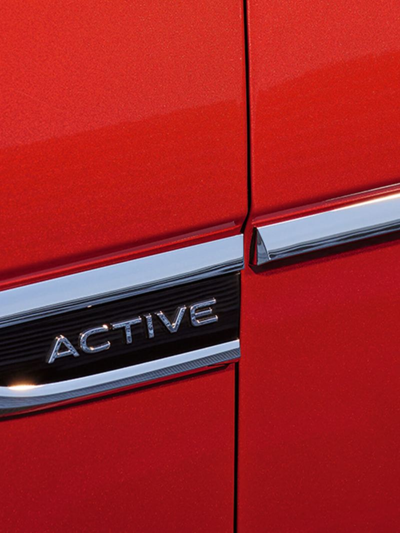 Close up of an “ACTIVE” badge on a red VW T-Roc Cabriolet.