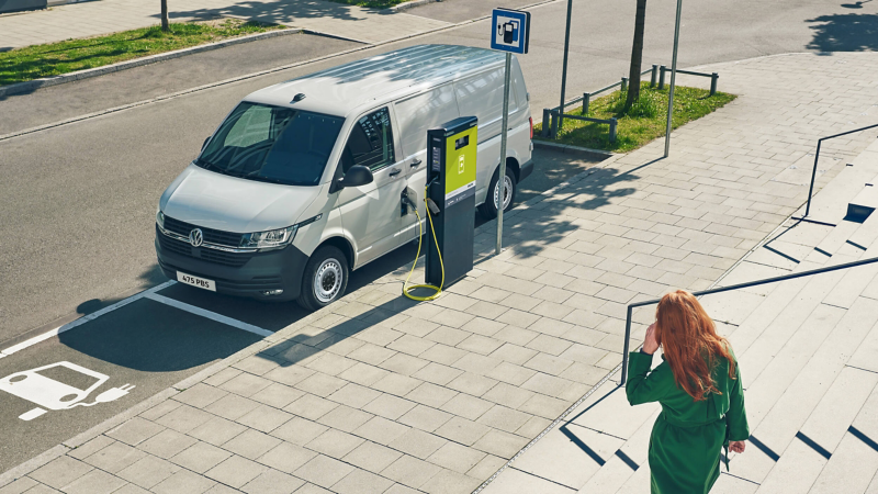 Eletric van charging in a city