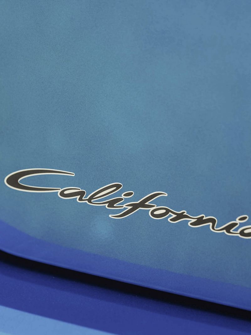 A close up of the Caddy California badge.