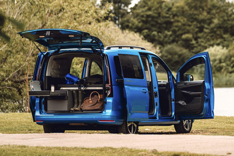 the rear of a Caddy California with boot open showing the spacious interior