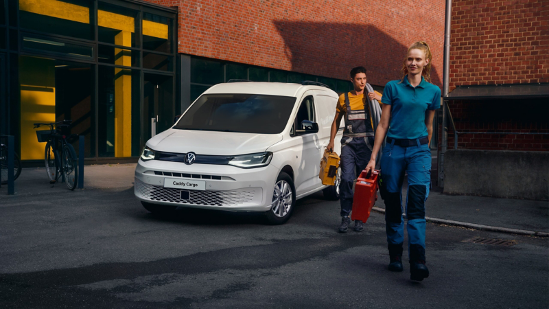 Workers walking away from a Caddy Cargo