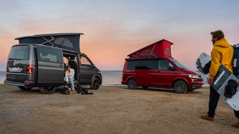Photo of two California's parked on a beach.