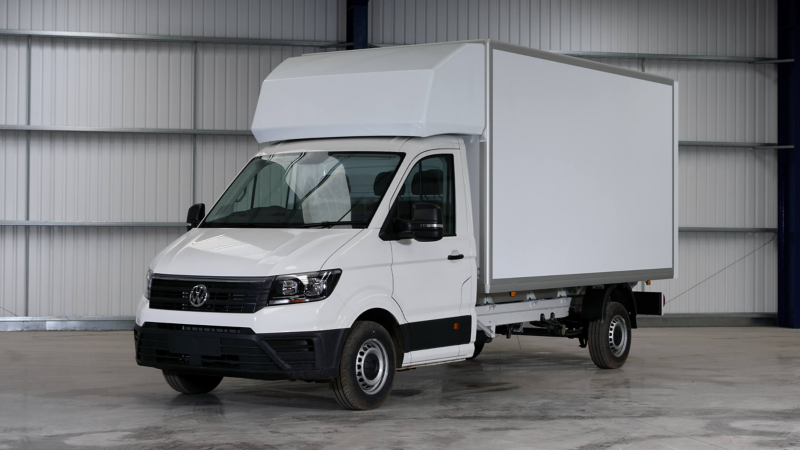 Crafter Luton panel van stationary in a warehouse.