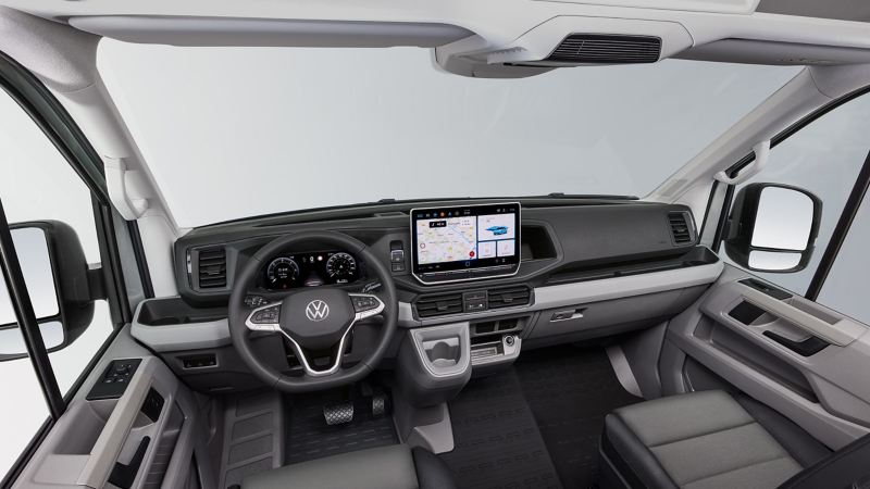 Photo showing the interior cockpit area of a VW van. 