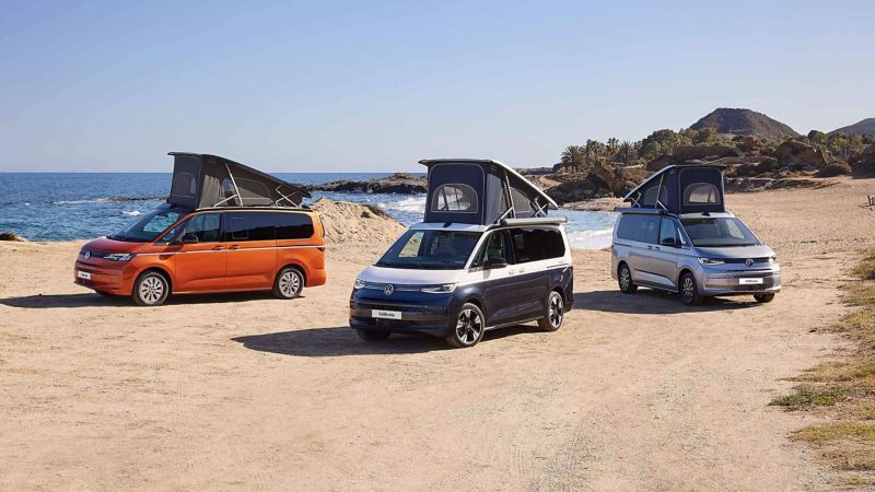 Photo showing three Californias parked on a beach.