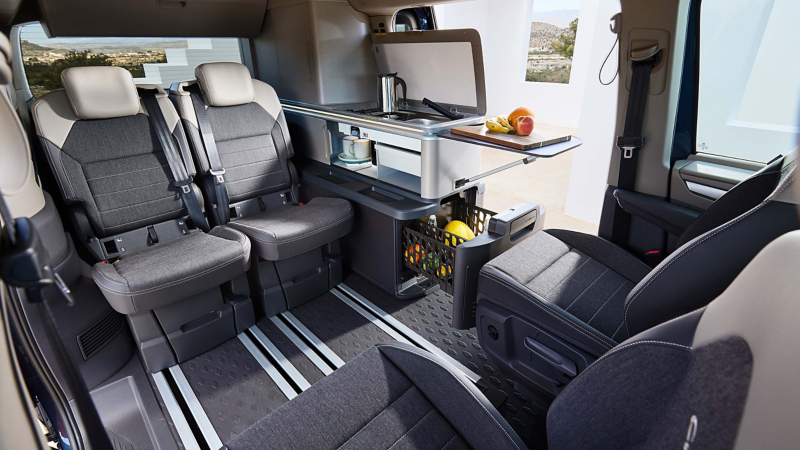 Photo showing the interior kitchen facilities of a VW California. 
