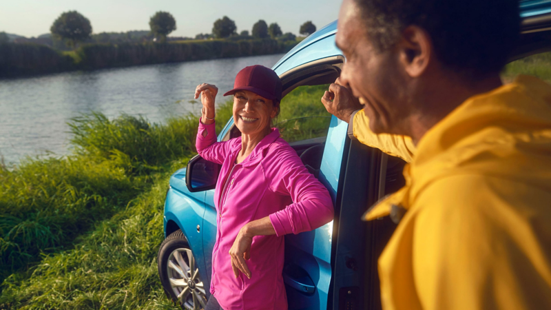 people standing outside of the new caddy