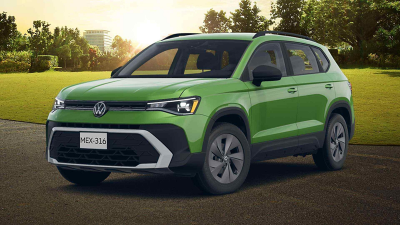 SUV Volkswagen Taos 2026 color verde estacionada frente a paisaje con árboles.