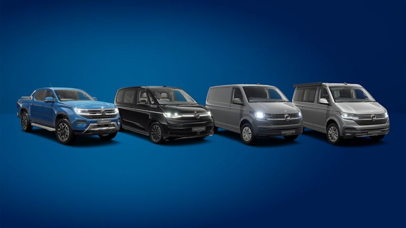 Image showing a range of VW Vans against a plain blue studio background. 