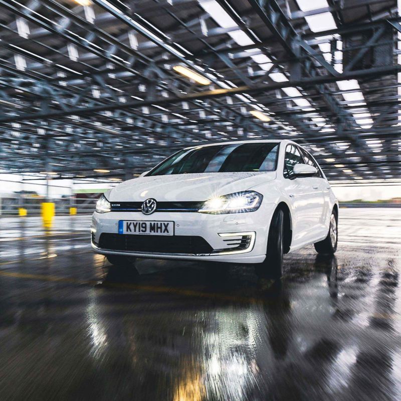 3/4 exterior front shot of a white Volkswagen e-Golf.