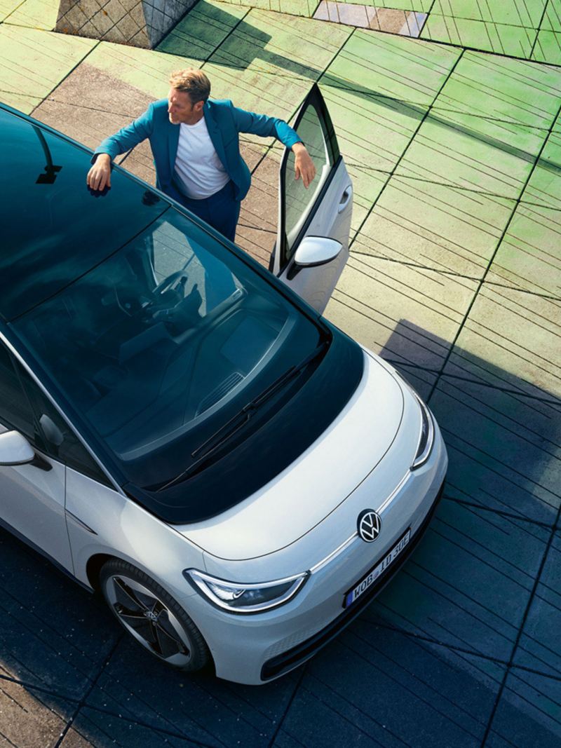 Aerial view of a man entering a Volkswagen ID.3
