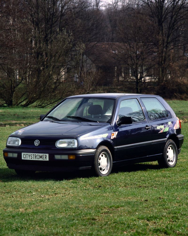 A Golf CitySTROMer parked in a green field