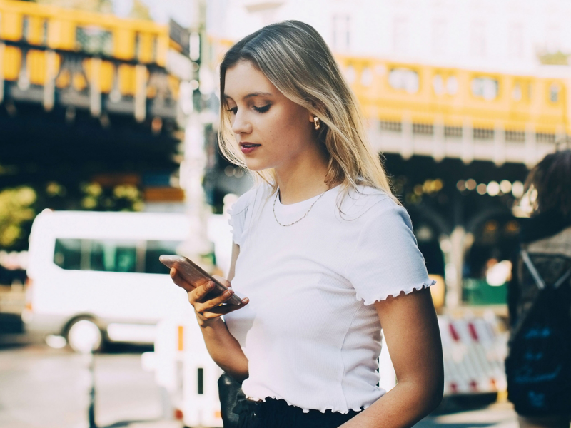 A woman holding a mobile phone