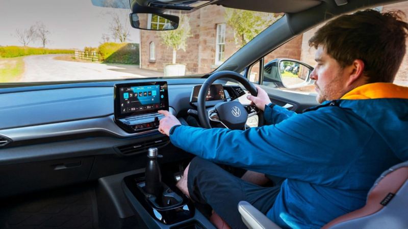 A man using his in car infotainment system