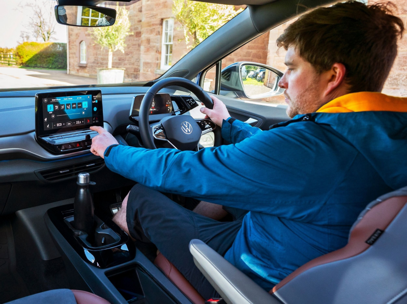 A man using his in car infotainment system