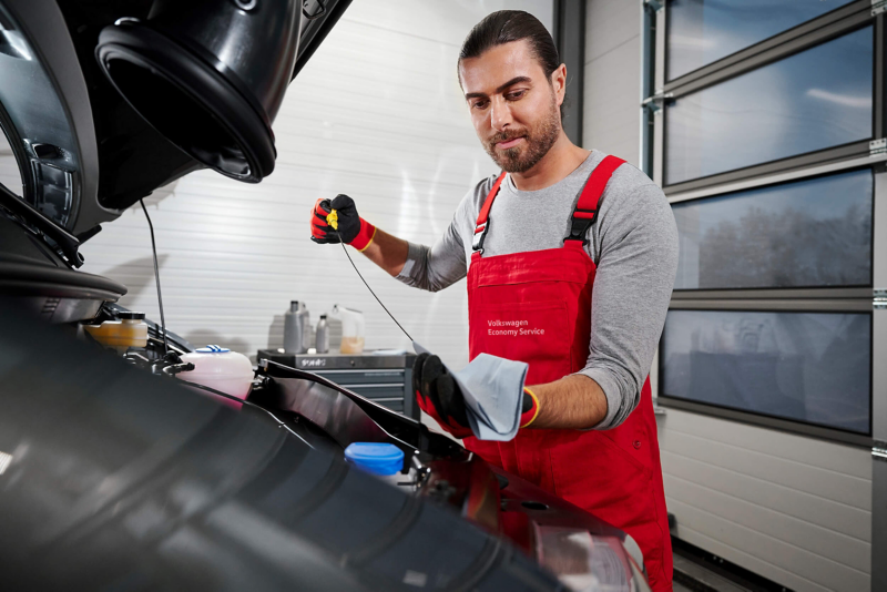 VW technician inspecting a van