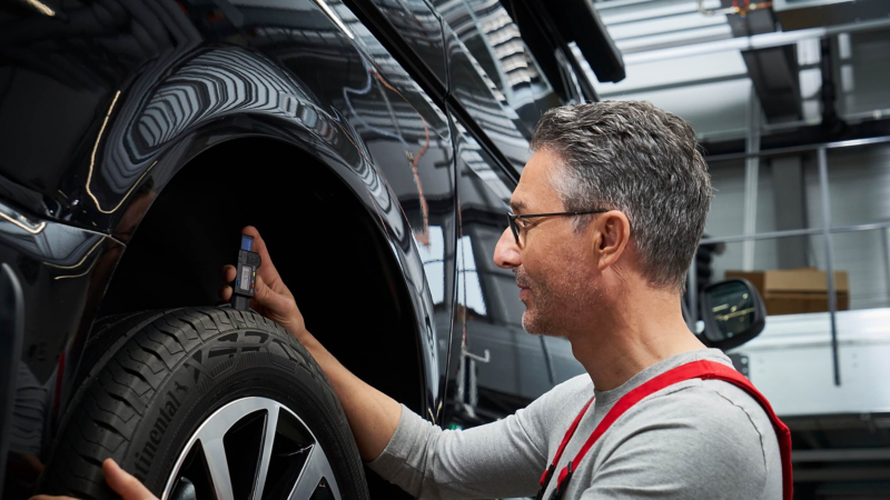 Volkswagen van receiving servicing and repair work in a workshop.