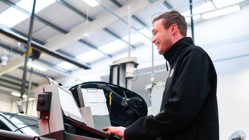 A technician typing into a computer