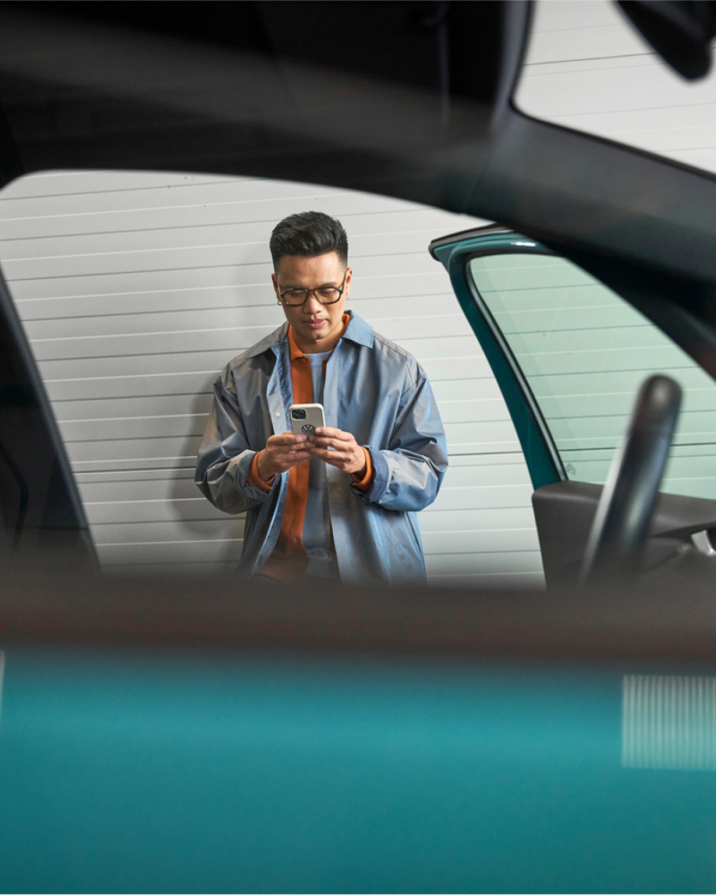 Man looking at mobile phone.