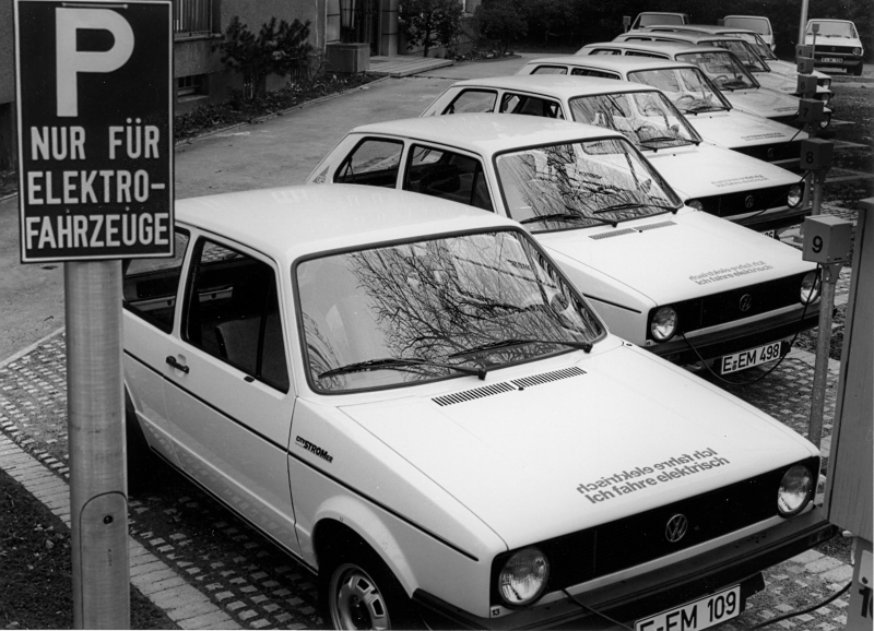 Black and white shot of a parking lot for e-vehicles