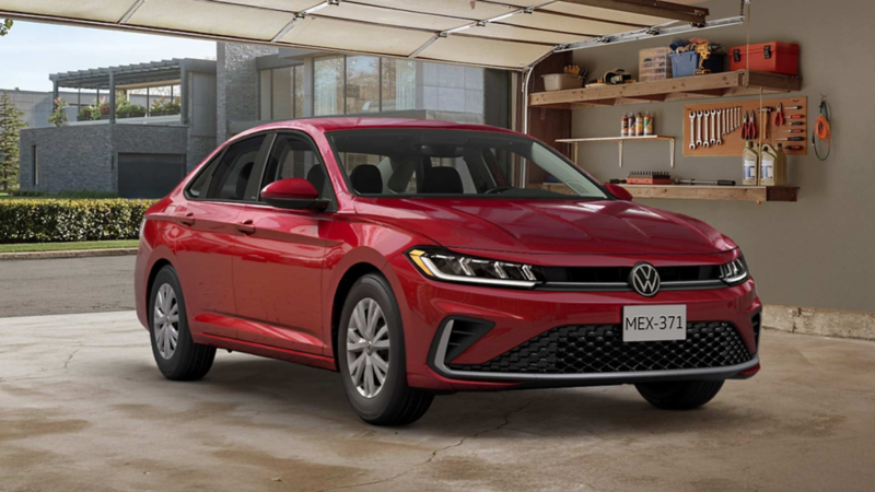 Volkswagen Jetta 2026 en color rojo estacionado dentro de un garage de residencia urbana.