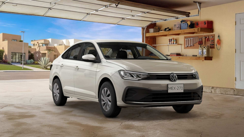 Volkswagen Virtus 2026 en color blanco estacionado dentro de un garage de residencia urbana.