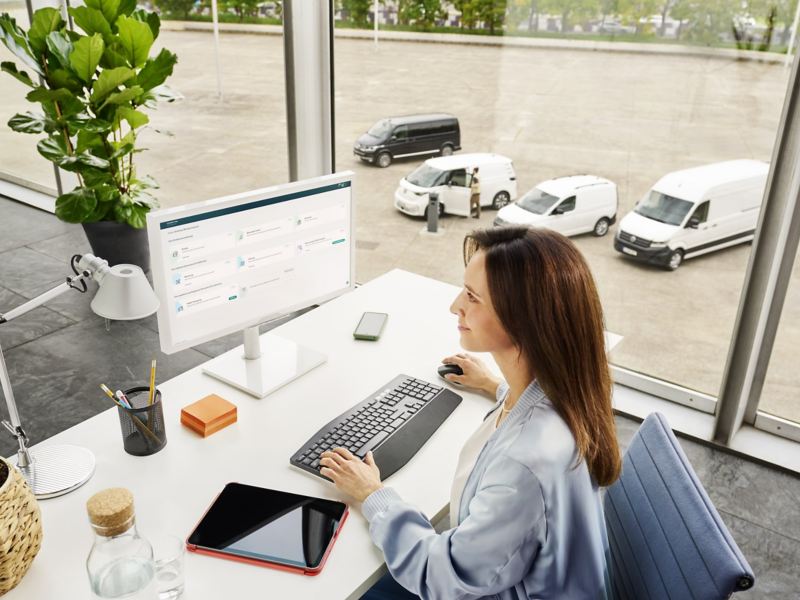 A man at a desk using a computer.