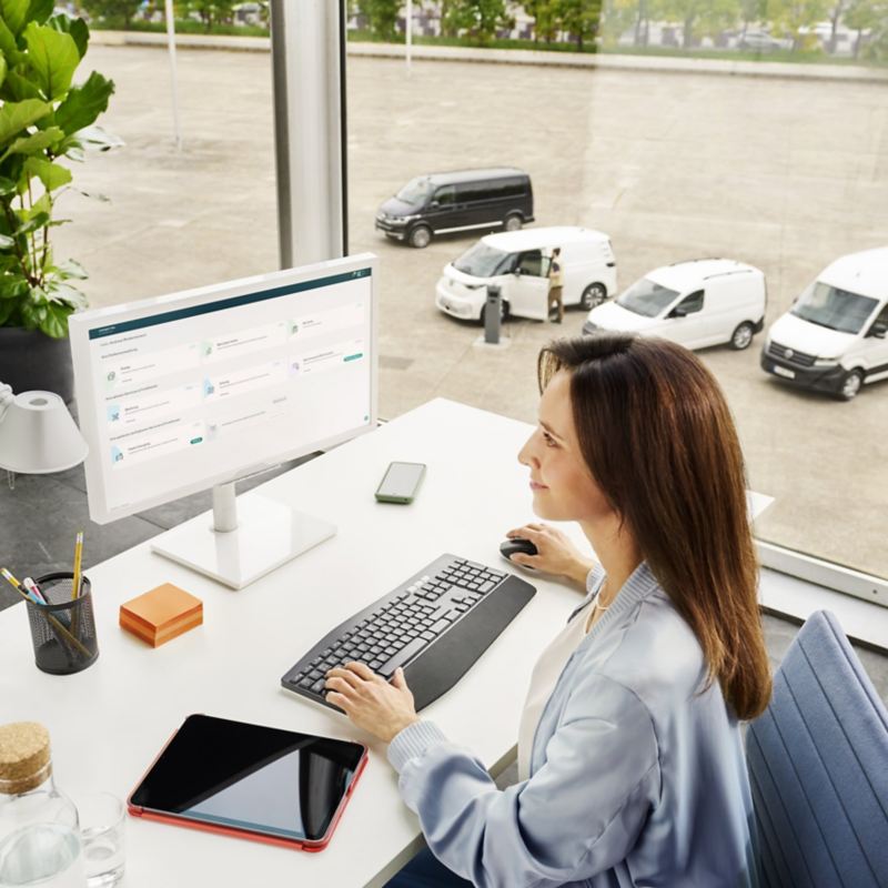 A man at a desk using a computer.