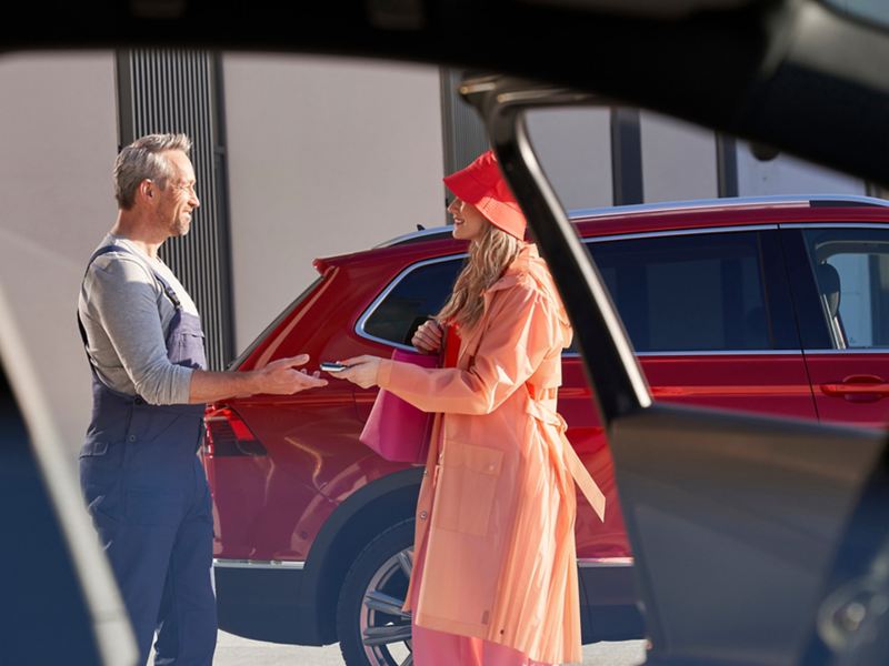 Woman handing over her car keys