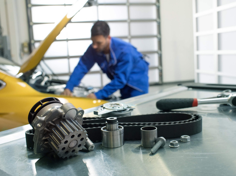 Technician working on a car