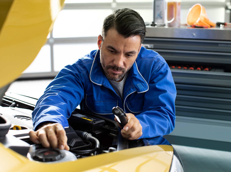 Technician working on a car