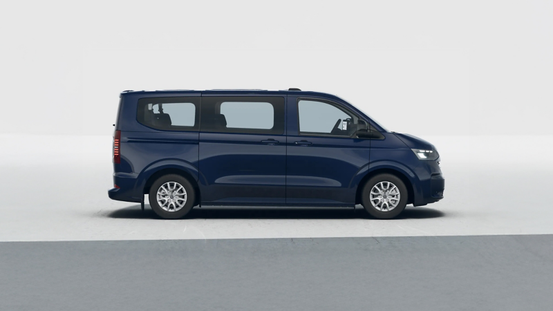 A VW Transporter Shuttle against a plain blue background. 