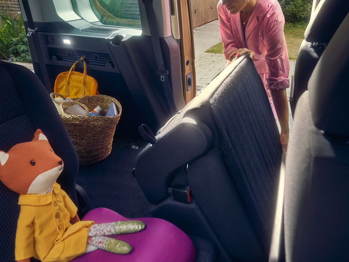 caddy-cargo-van-interior-being-loaded-by-woman