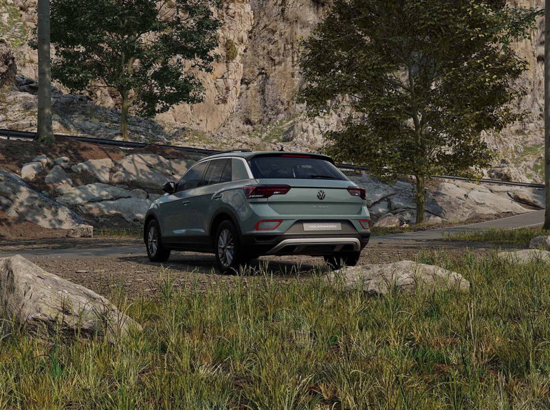 The back of a green VW T-Roc Life in a country setting