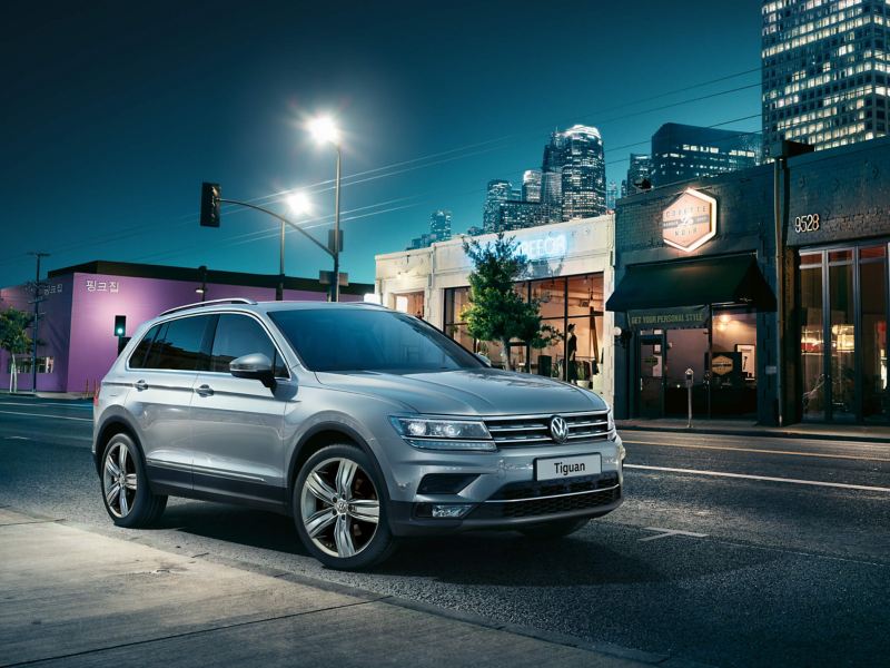 3/4 front view of a silver Volkswagen Tiguan.