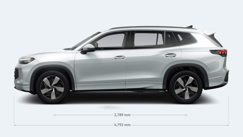 Sleek silver Volkswagen Tayron SUV in profile view, emphasising streamlined design. Dimensions marked with a focus on length and wheelbase, conveying modern elegance.