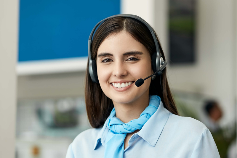 Photo of a woman working at a VW call centre. 