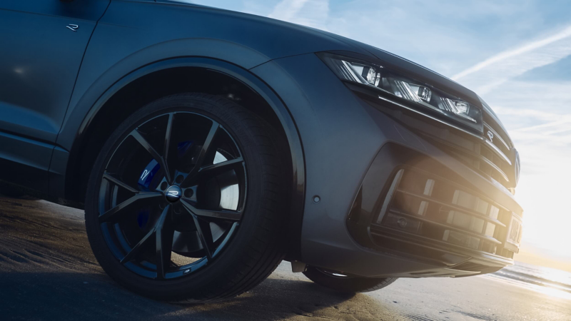 A side view of the wheel and front bumper of a VW Touareg