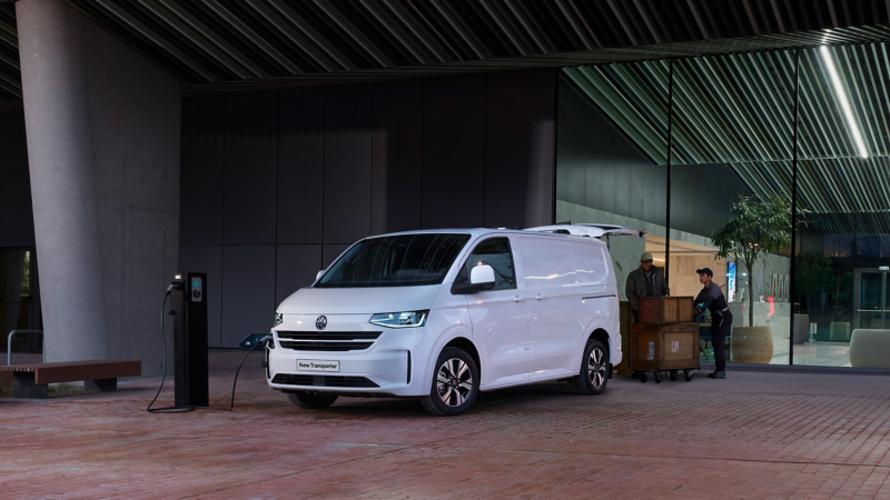 Exterior photo showing the new e-Transporter plugged in at a wallbox charger.
