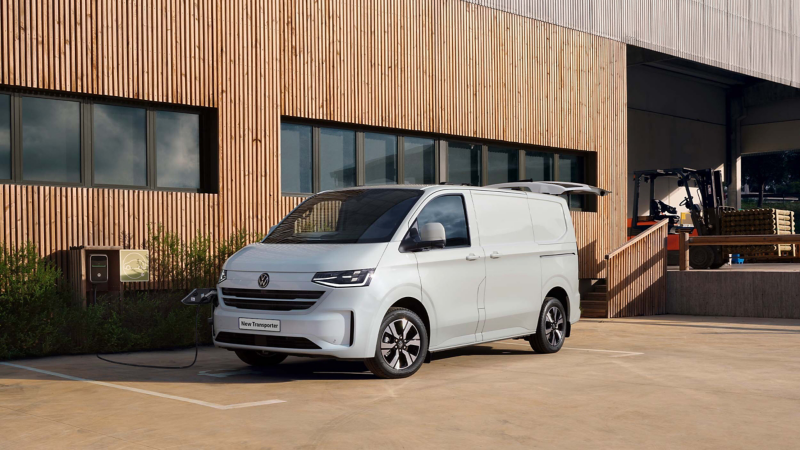 All-electric e-Transporter panel van charging at a wallbox.