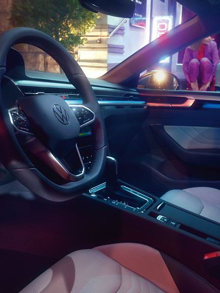A drivers view of the Arteon Shooting Brake's interior, showing its leather steering wheel and stylish dashboard.