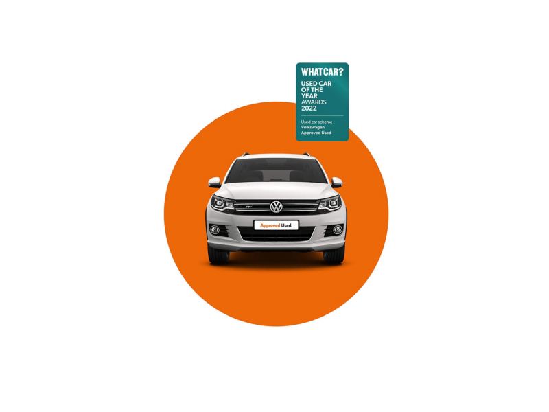 A white used VW Tiguan on an orange background with the What Car? Used Car of the Year Awards 2022 logo