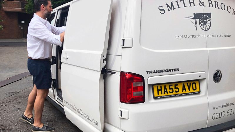 Nick, director of Smith & Brock loading a Volkswagen Transporter panel van