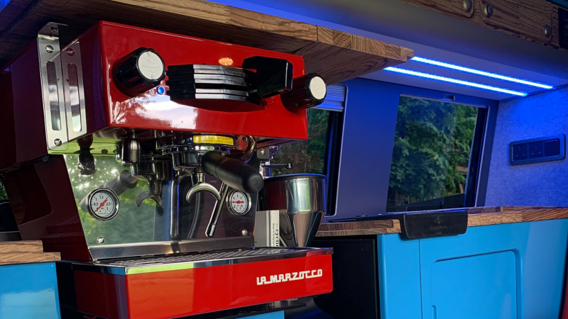 Photo showing a coffee machine inside a converted VW Transporter.