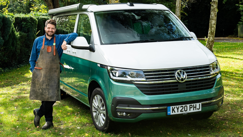 Chef Tom leaning against a California camper van