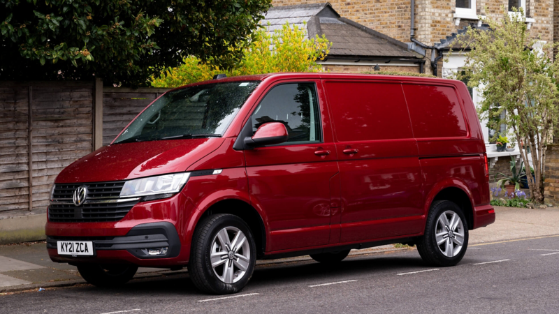 A VW Transporter parked in a suburban setting.