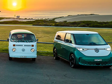 ID Buzz & VW camper parked next to each other at sunset